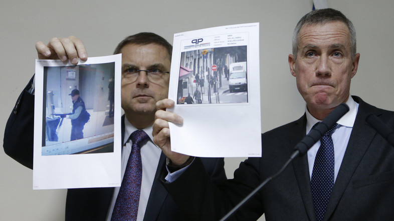 Paris prosecutor Molins and director of the Paris' judiciary police Flaesch show two photographs of the suspect gunman taken from surveillance footage during a news conference in Paris