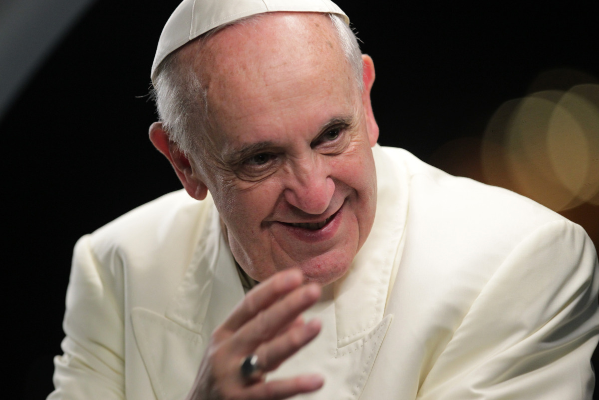 Pope Francis greets the faithful as he arrives at Copacabana Beach to celebrate mass on his sixth day in Rio de Janeiro