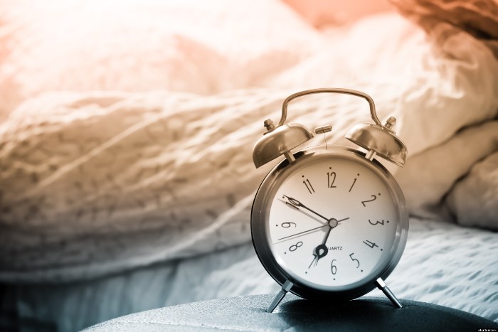 clock and bed showing wake time in bedroom; Shutterstock ID 79186387; PO: The Huffington Post; Job: The Huffington Post; Client: The Huffington Post; Other: The Huffington Post