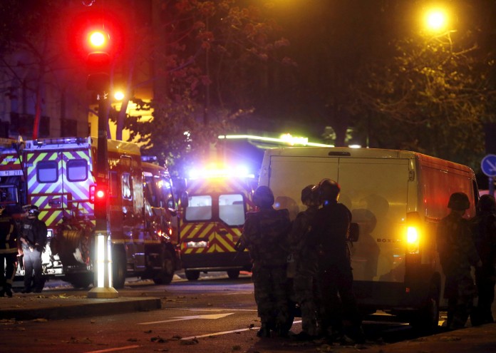 French riot police secure the area near the Bataclan concert hall following a fatal shooting at a restaurant in Paris