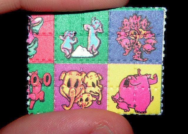  640px-Pink_Elephants_on_Parade_Blotter_LSD_Dumbo 
