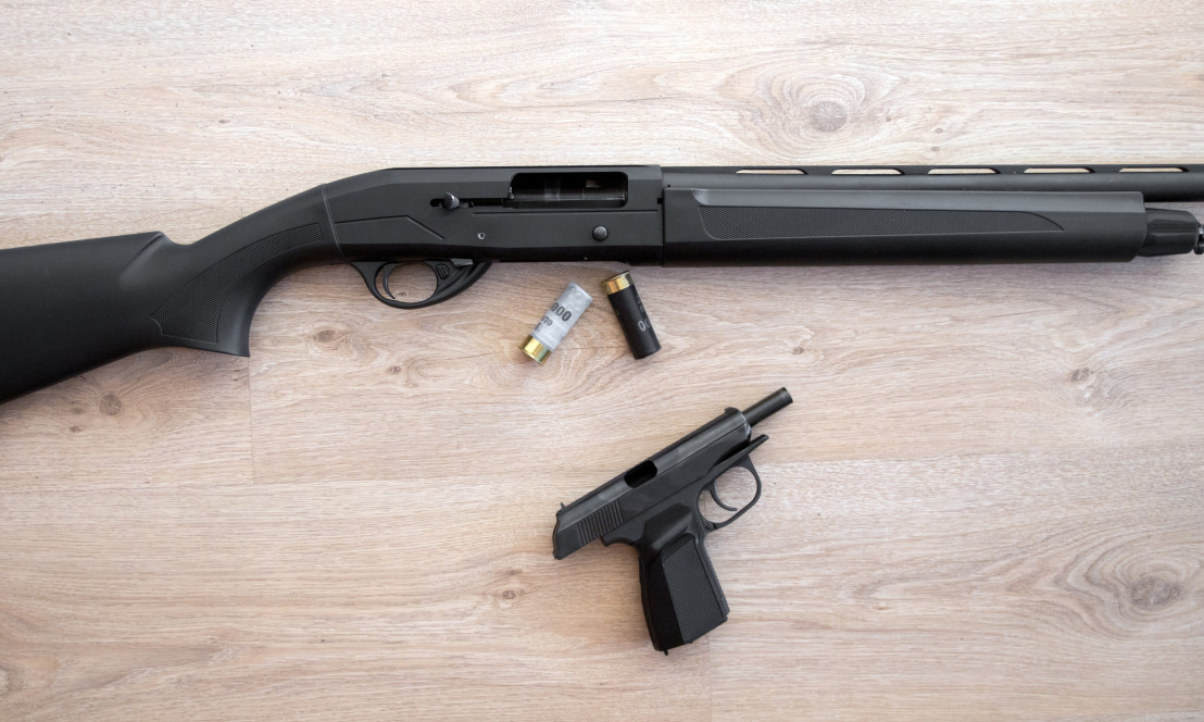  semi-automatic black hunting shotgun, cartridges 12 gauge, and makarov pistol 