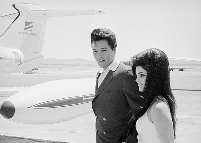  Elvis and Priscilla Presley at Airplane Door 