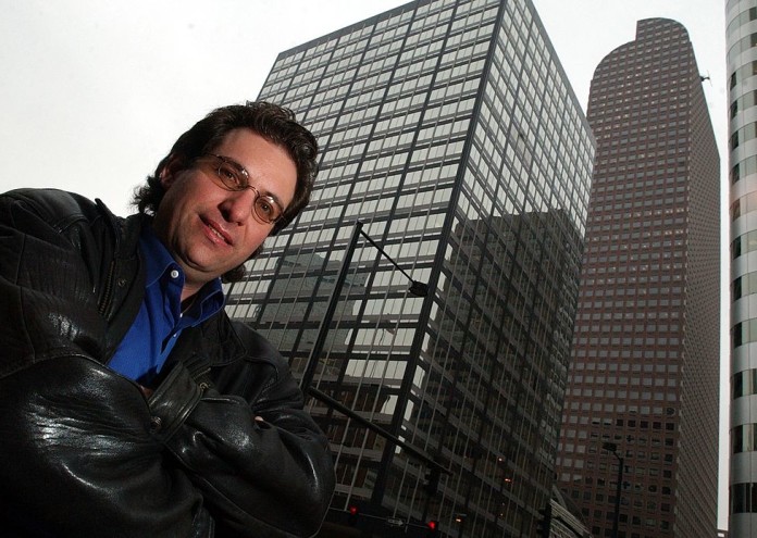 Kevin Mitnick, the worlds most notorious hacker poses for a portrait outside the Cash register building in downtown Denver where he worked under the alias id Eric Weiss at the Law firm of Holme, Roberts and Owen. (Craig F. Walker / The Denver Post)