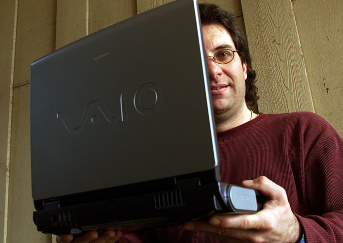  Thousand Oaks resident Kevin Mitnick, 39, holds up his Sony laptop notebook computer. Mitnick is a c 
