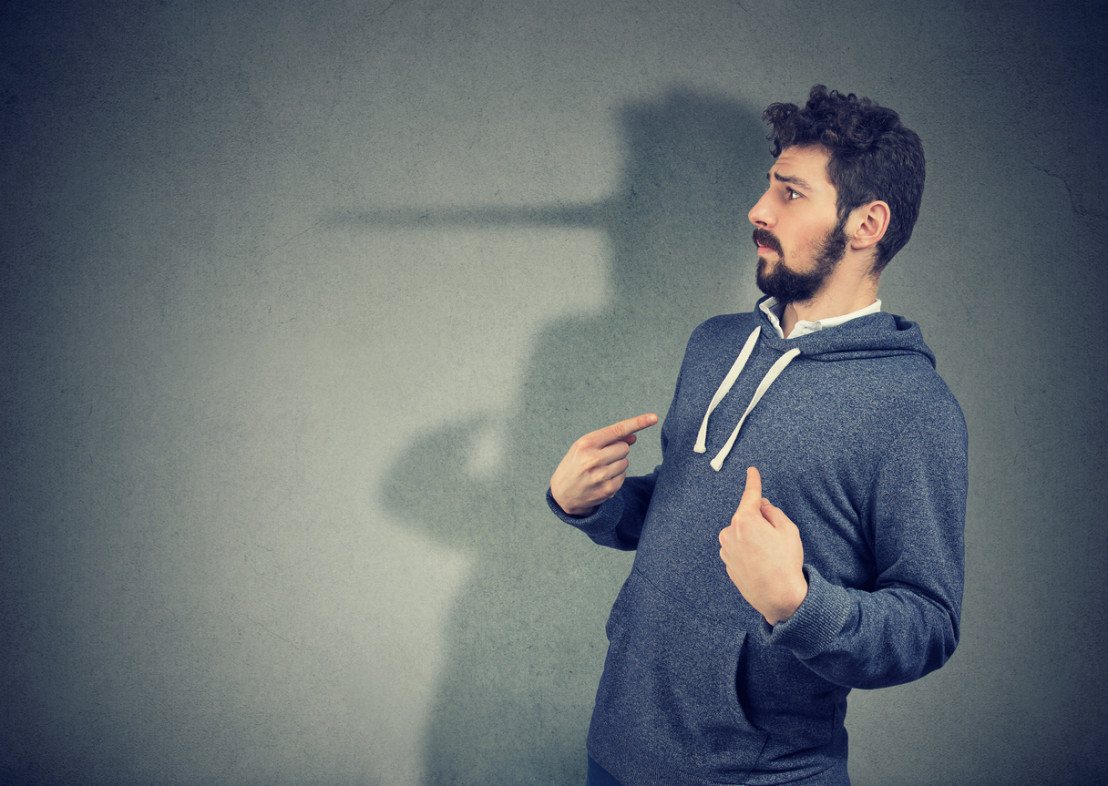  Hypocritical man lying expressively 